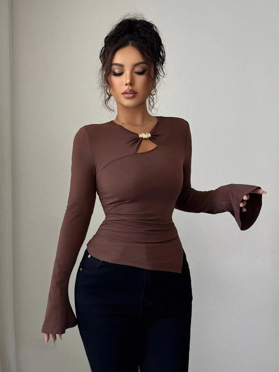 Cutout long sleeve top with gold ring and asymmetrical hem