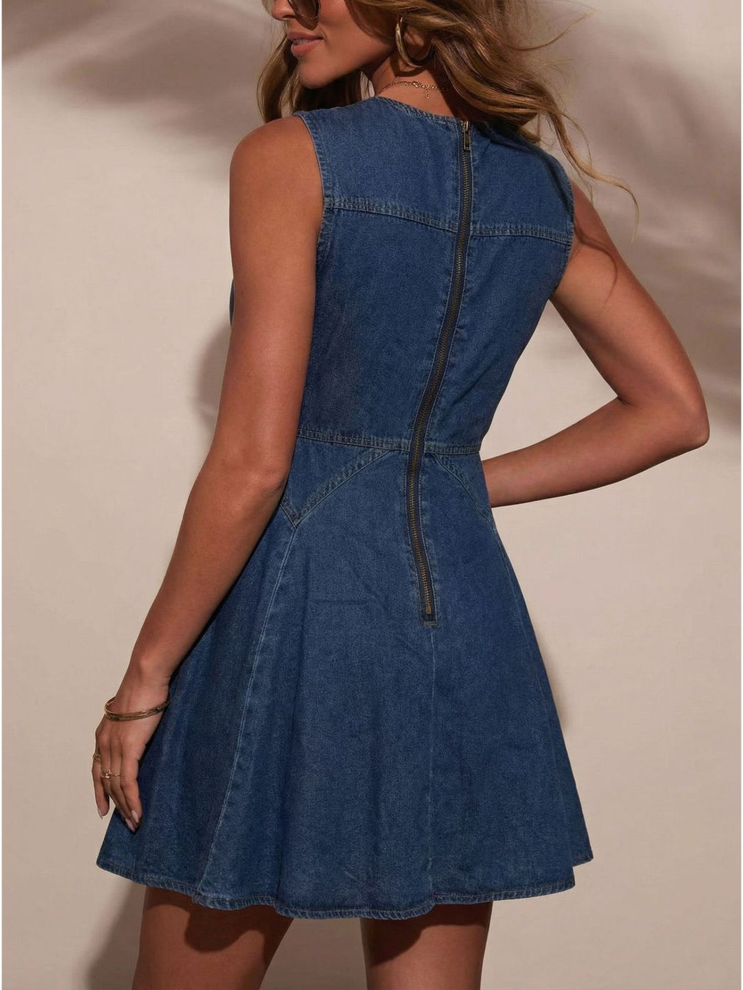 Sleeveless denim mini dress with jeweled buttons