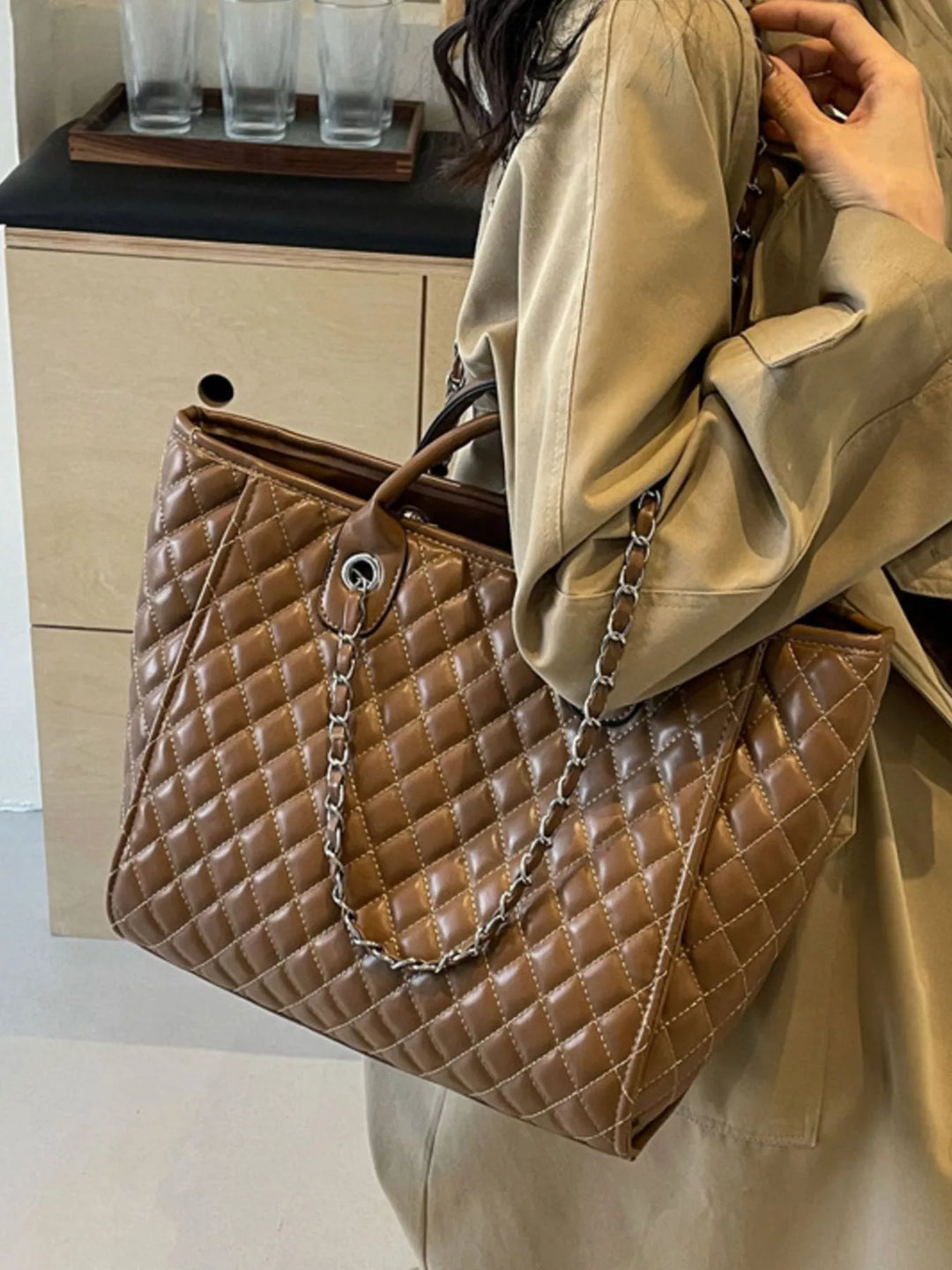 Diamond quilted faux leather tote bag with chain straps