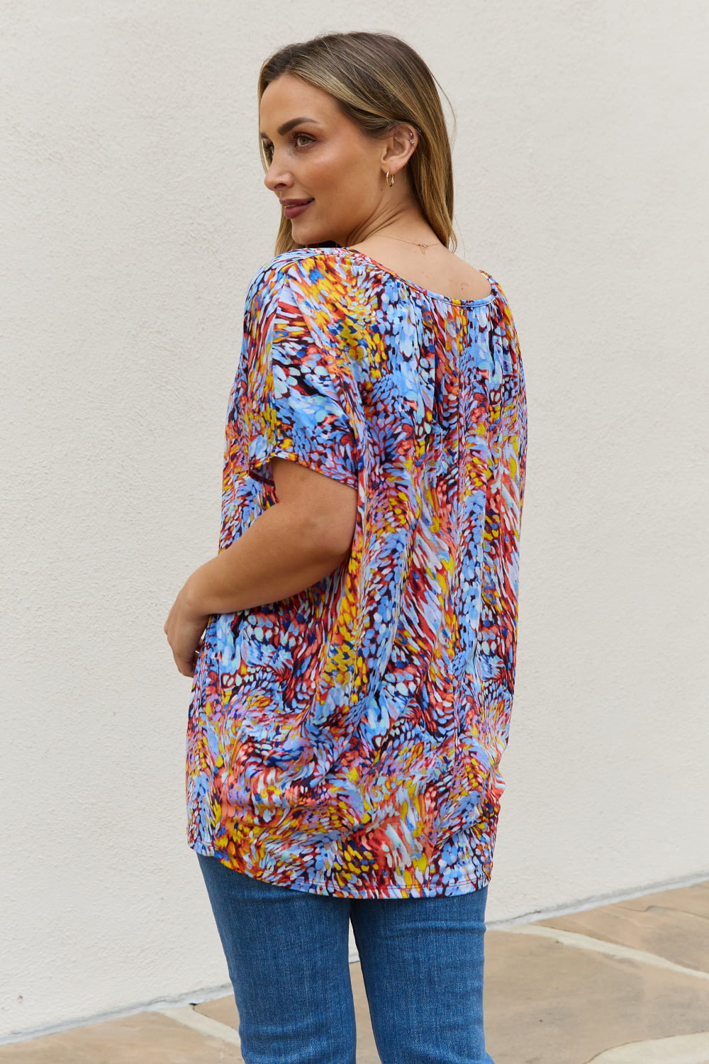 Abstract print dolman sleeve flowy V-neck top