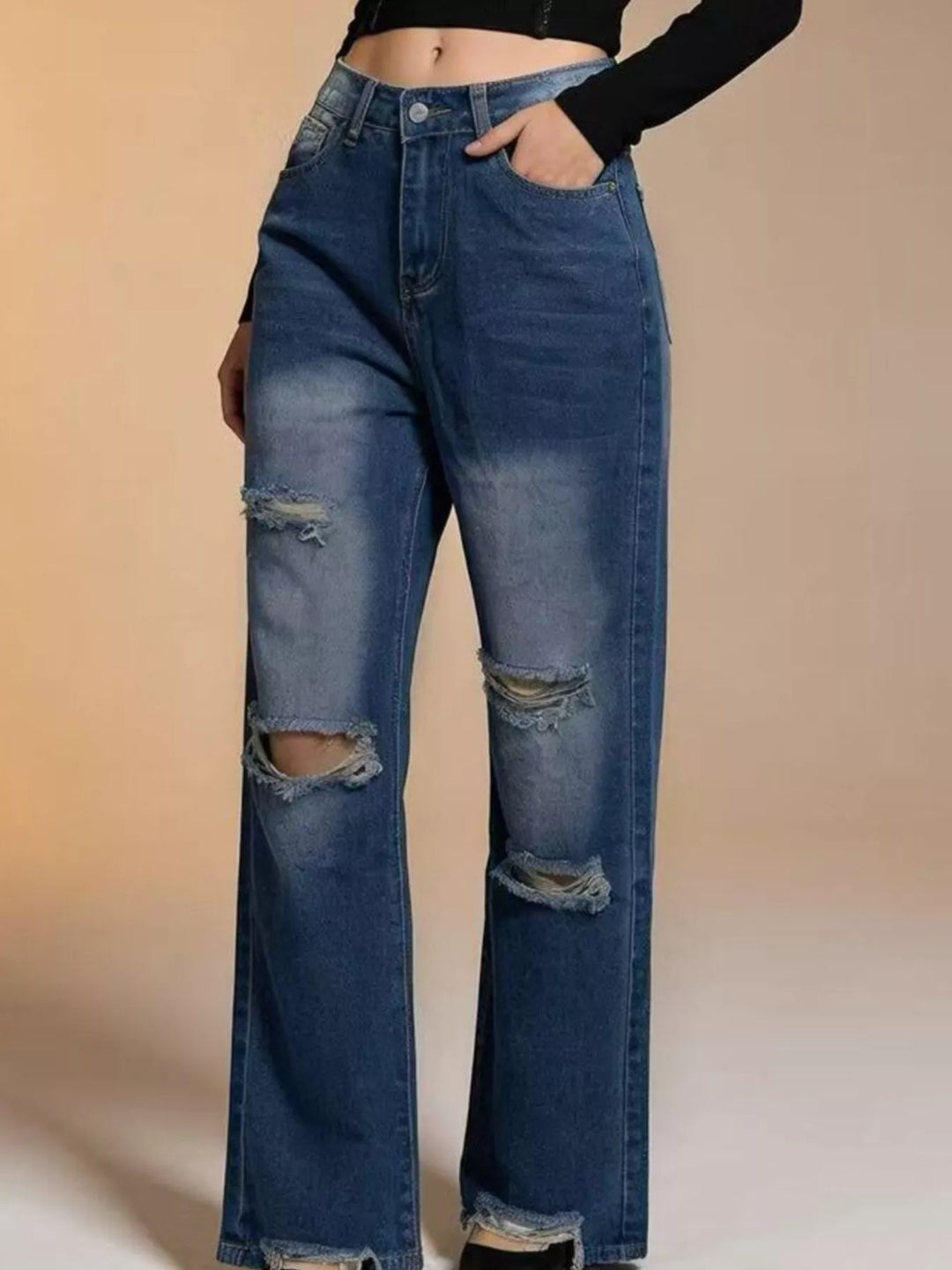 Distressed wide-leg jeans with raw frayed hem