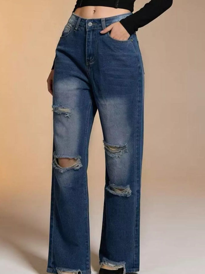 Distressed wide-leg jeans with raw frayed hem