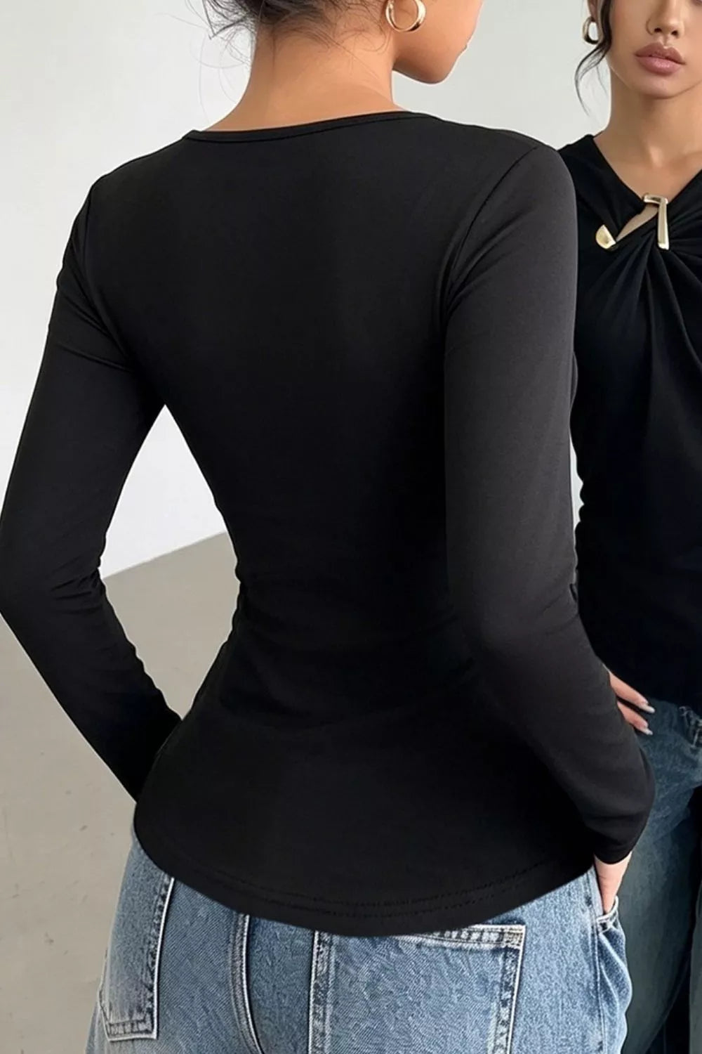 Asymmetric neckline ruched long sleeve top with gold bar