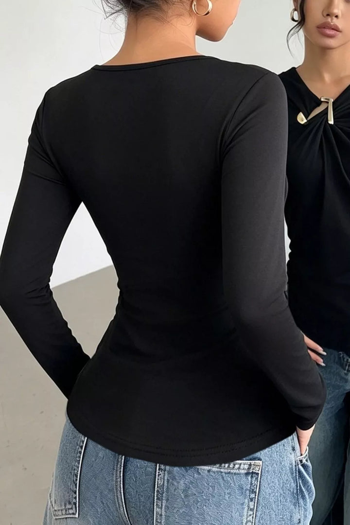 Asymmetric neckline ruched long sleeve top with gold bar