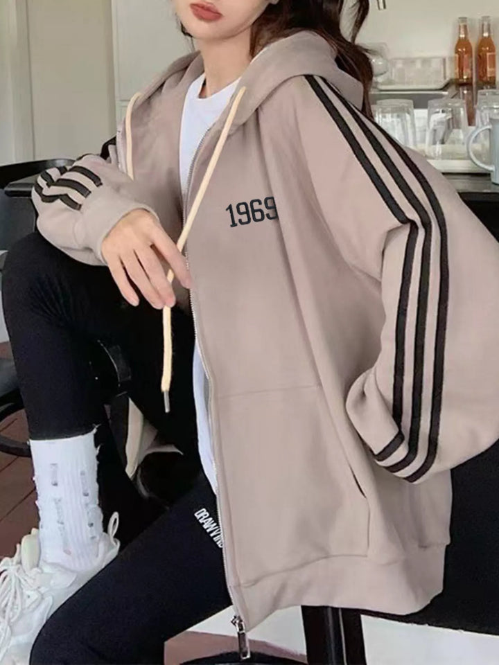 Oversized zip-up hoodie with striped sleeves and drawstring hood