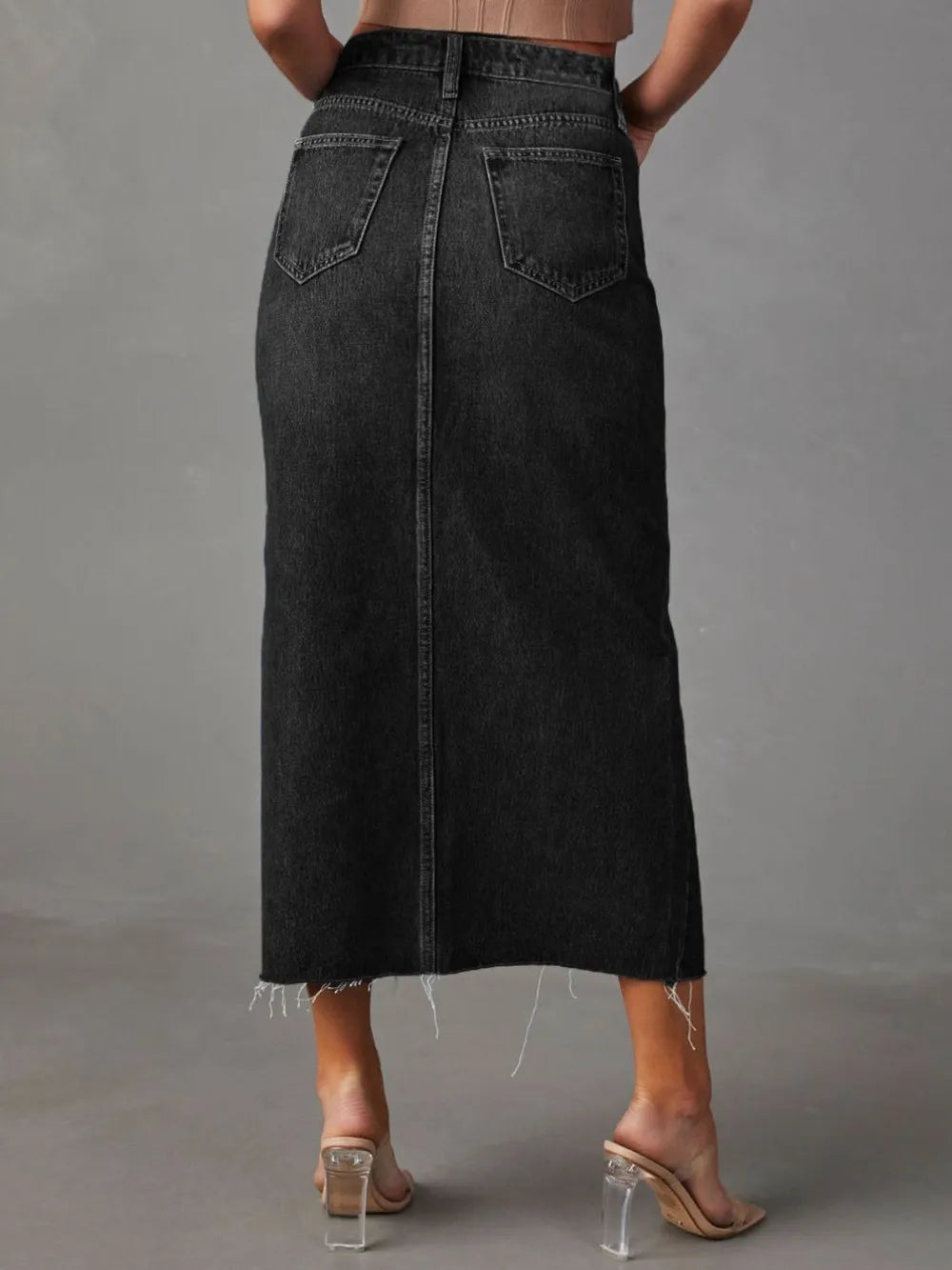 High-rise denim midi skirt with raw hem and front slit