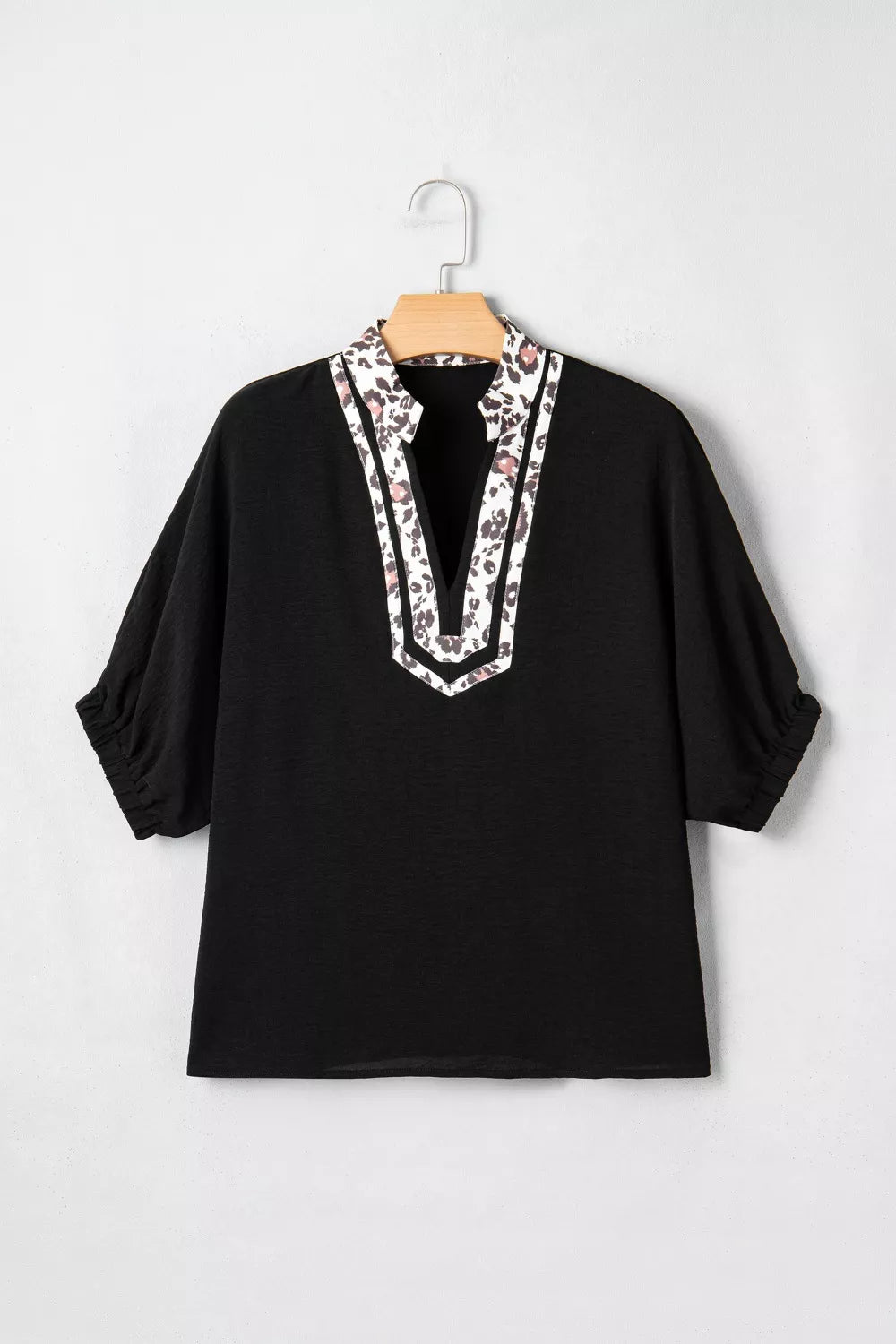 Plus size notched V-neck top with leopard collar trim