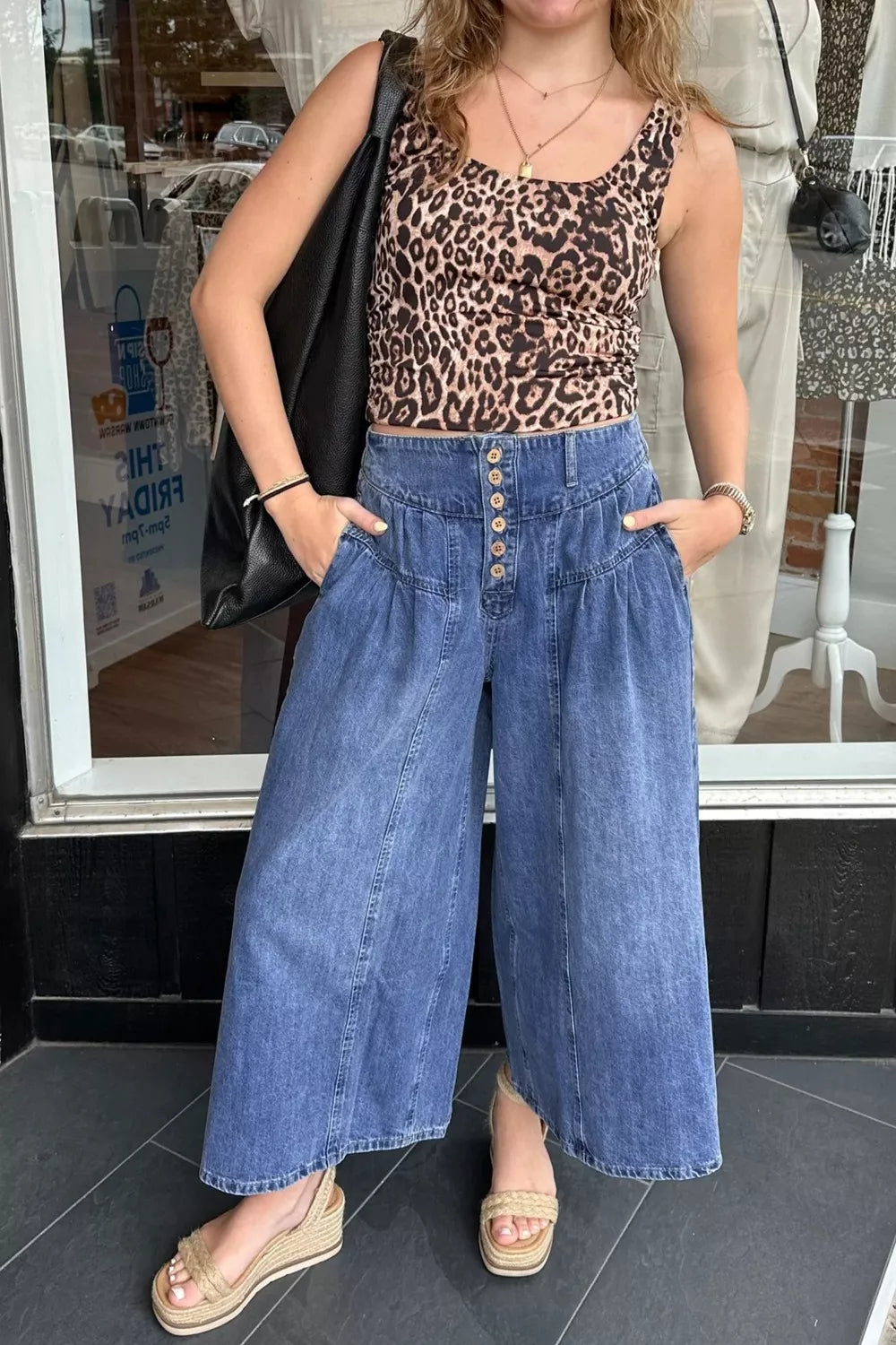 High-rise wide-leg button-fly jeans with pleated waist