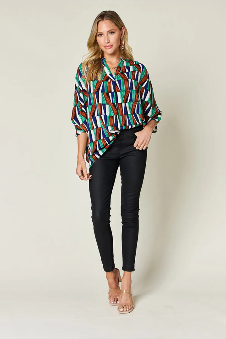 Geometric print notched neck dolman sleeve top
