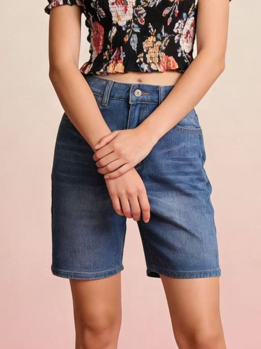 High-rise bermuda denim shorts with whiskered front