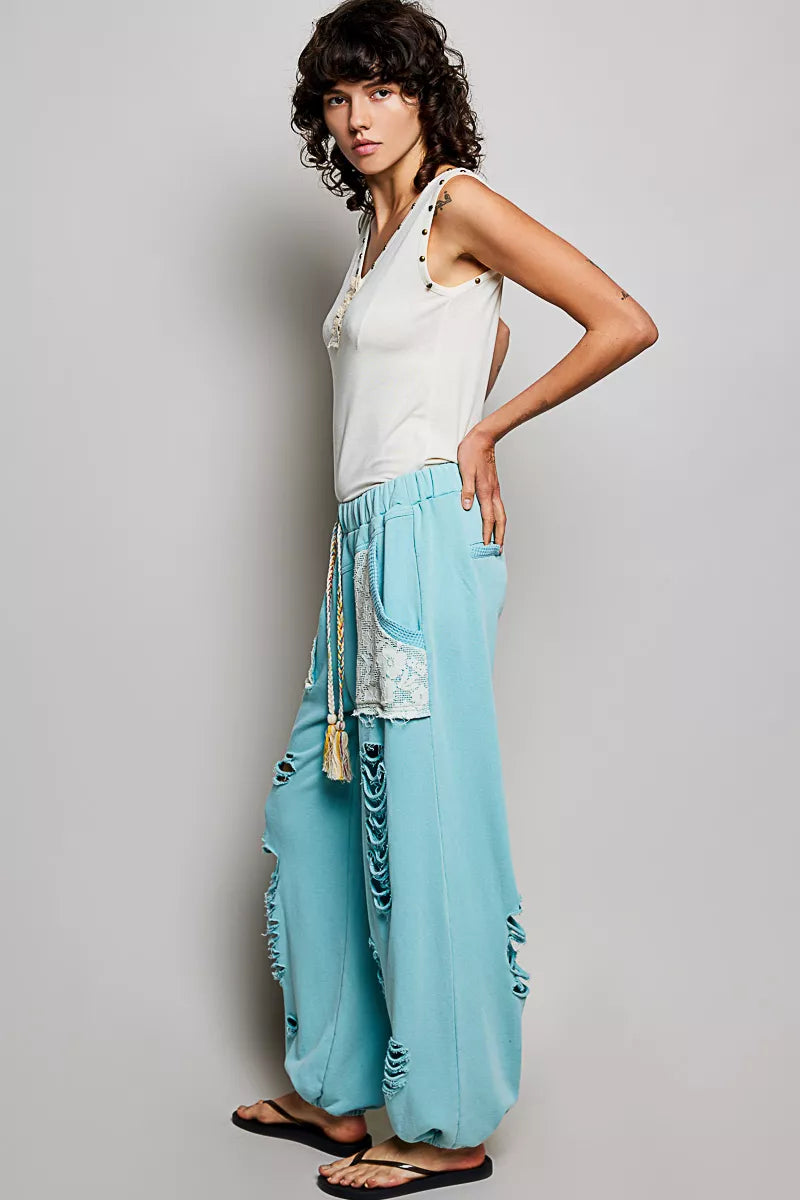 Studded V-neck sleeveless knit tank with button-front ruffle