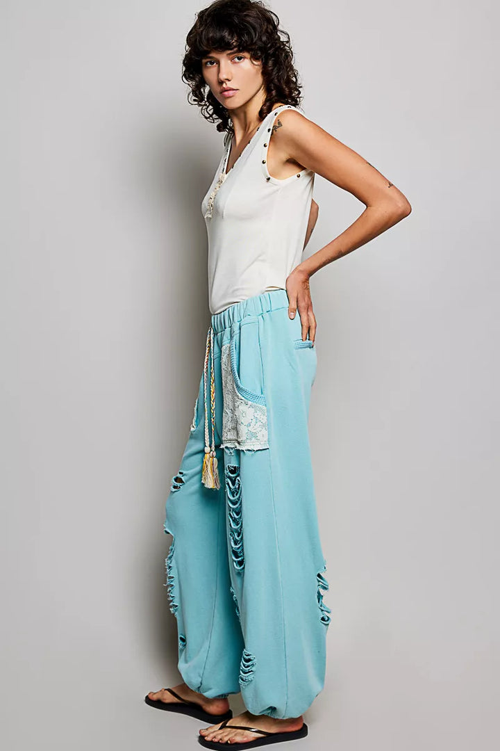 Studded V-neck sleeveless knit tank with button-front ruffle