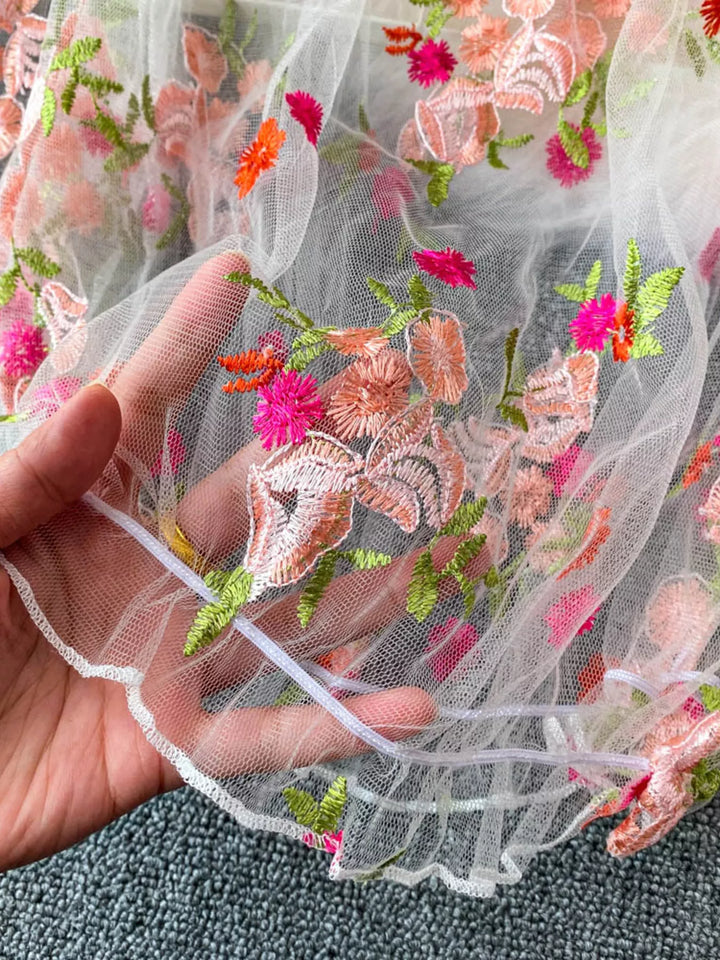 Floral embroidered off-shoulder mesh crop top with puff sleeves