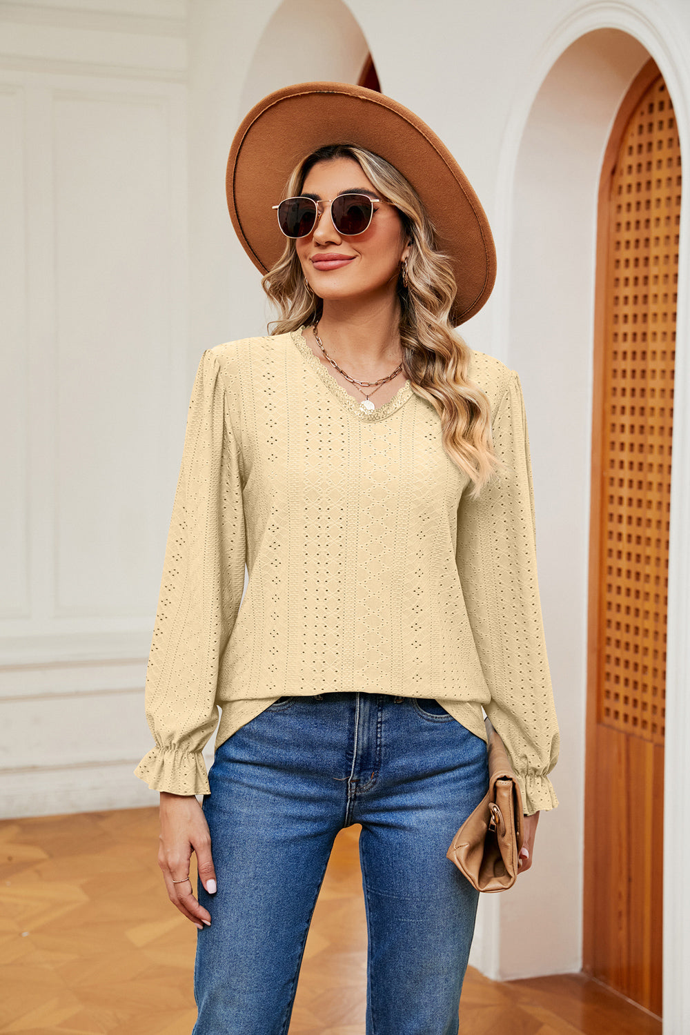 Eyelet V-neck blouse with flounce sleeves and lace trim
