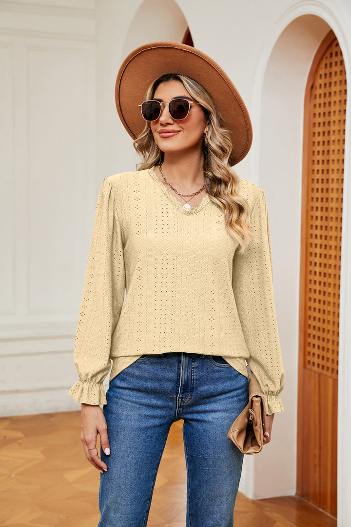 Eyelet V-neck blouse with flounce sleeves and lace trim