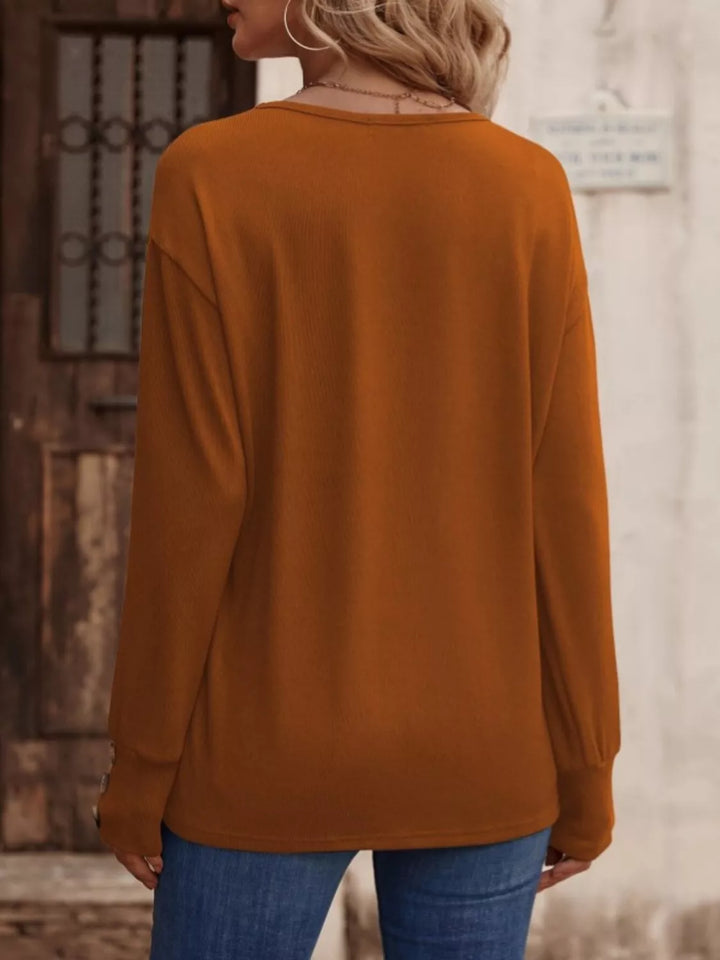 V-neck long sleeve top with button cuffs