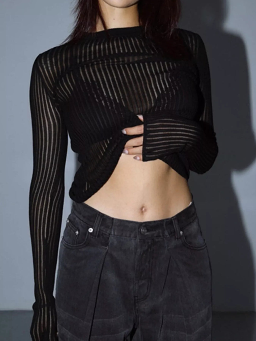Sheer ribbed knit long sleeve top with flared cuffs