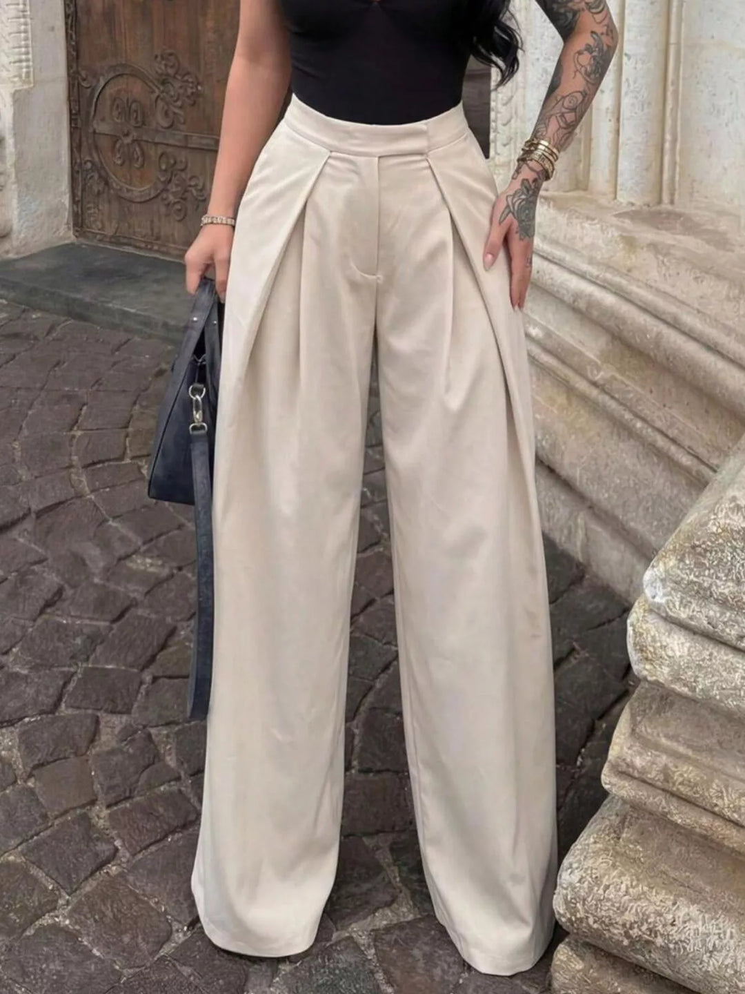 High-rise pleated wide leg pants with deep front pleats