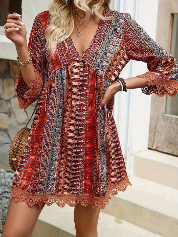 Boho printed mini dress with lace trim and bell sleeves