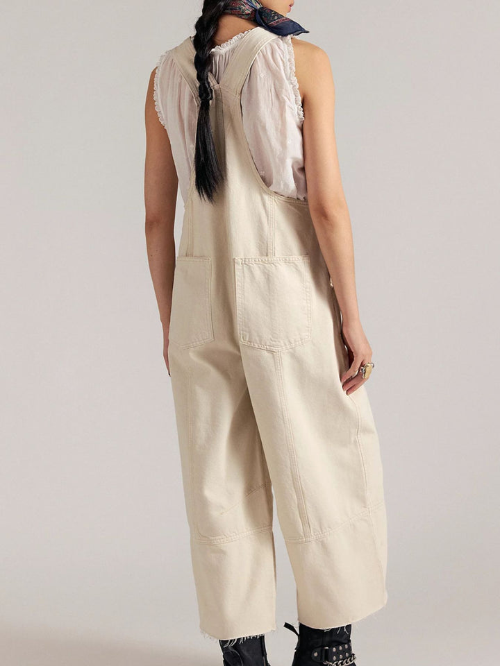 Pleated wide-leg denim overalls with raw hem