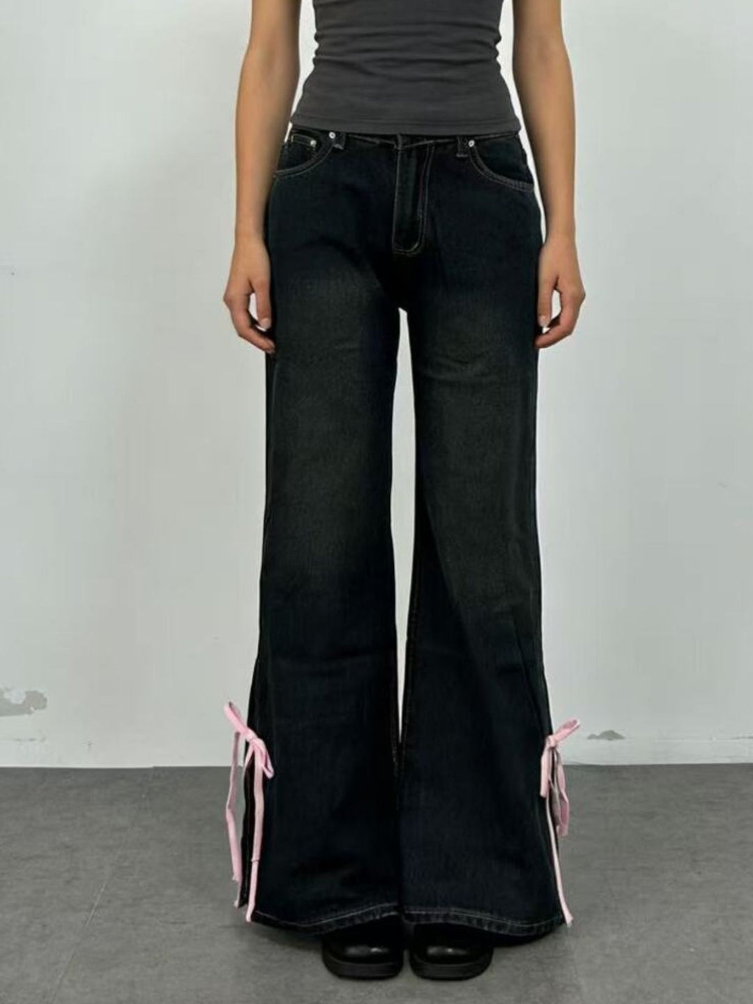 Low-rise flare jeans with ribbon bow leg slits