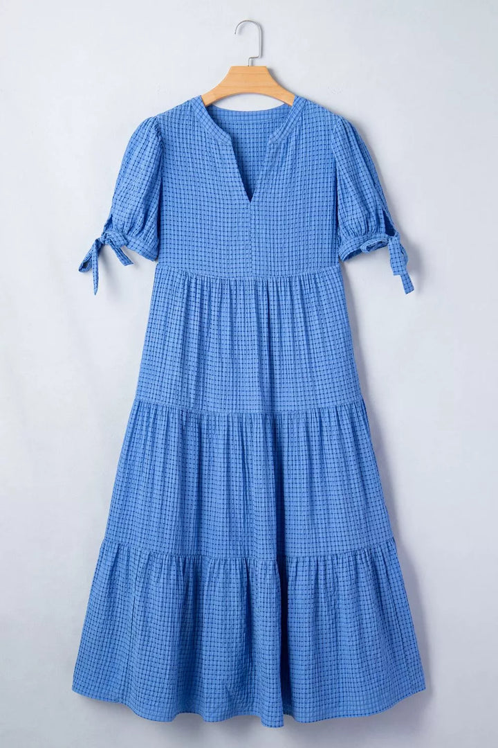 Tiered midi dress with notched neckline and tie sleeves