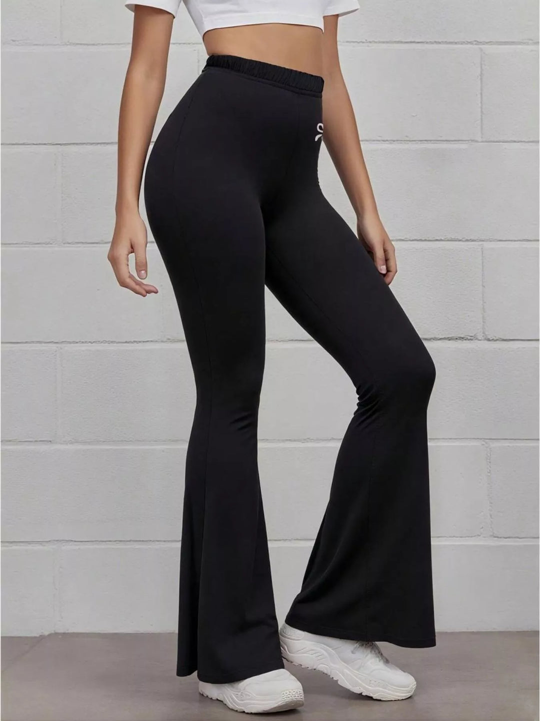 High-rise flare active pants with embroidered bow