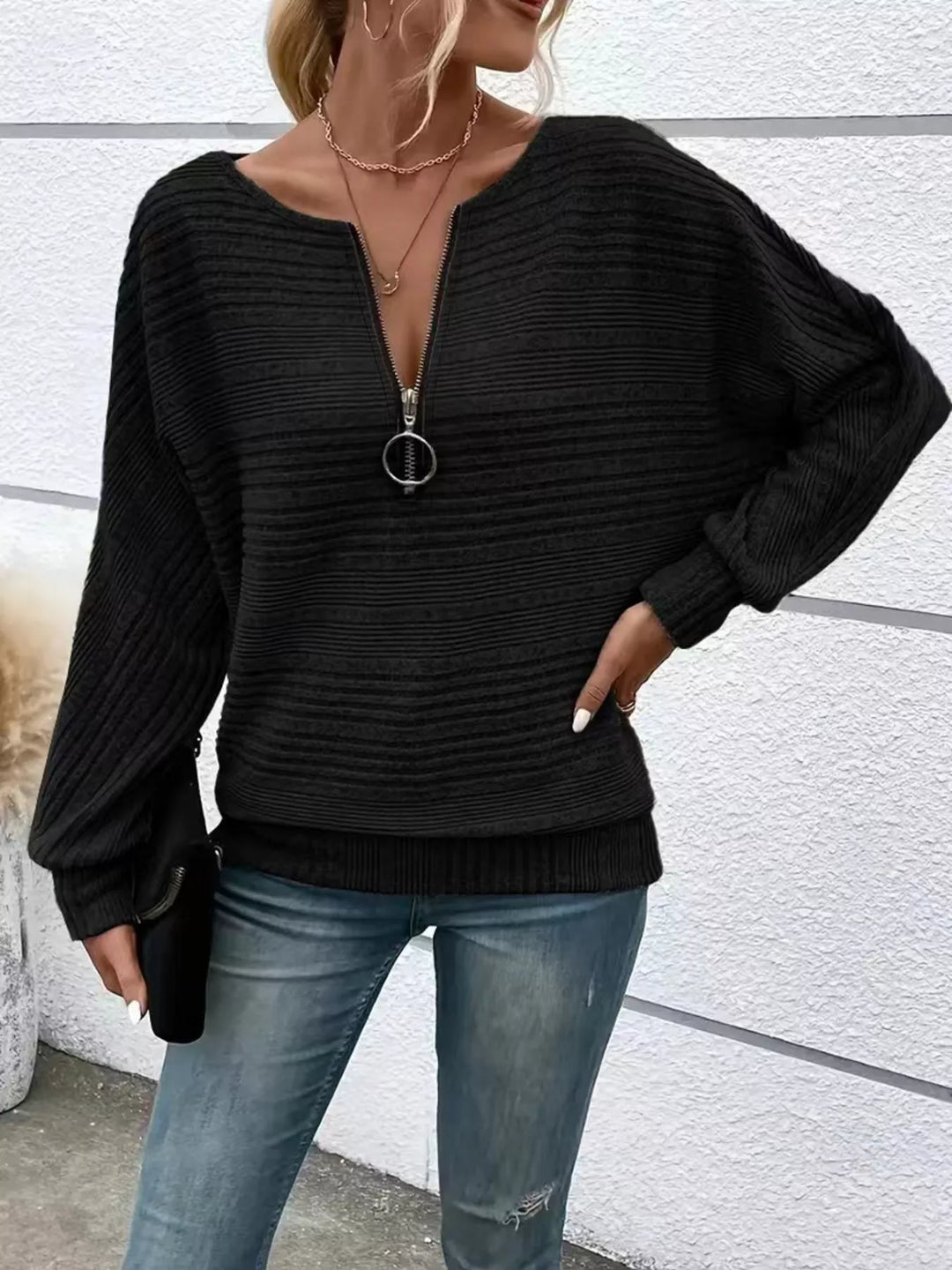 Ribbed knit quarter-zip batwing sweater with O-ring pull