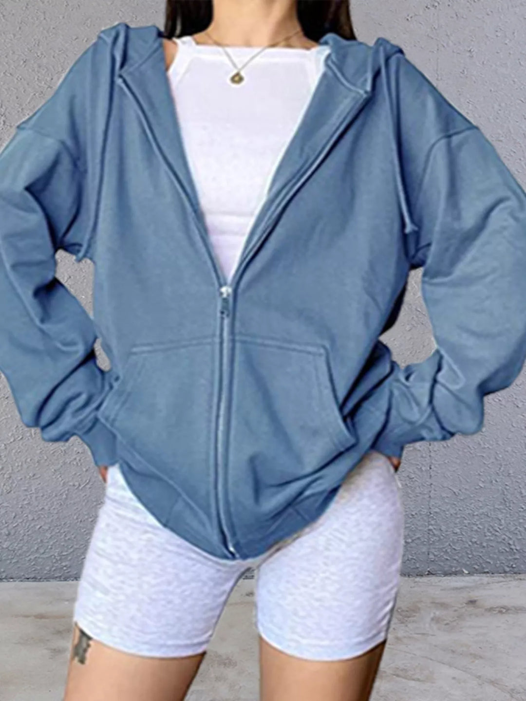 Oversized zip-up hoodie with drawstring hood and front pockets