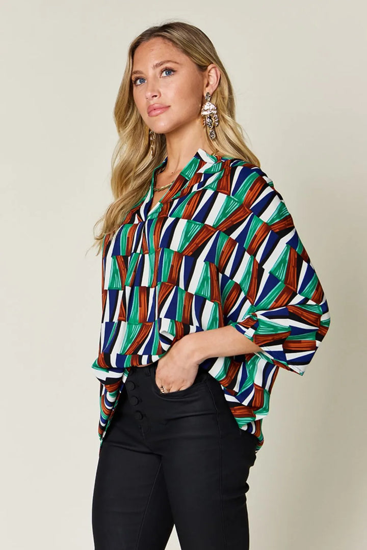 Geometric print notched neck dolman sleeve top