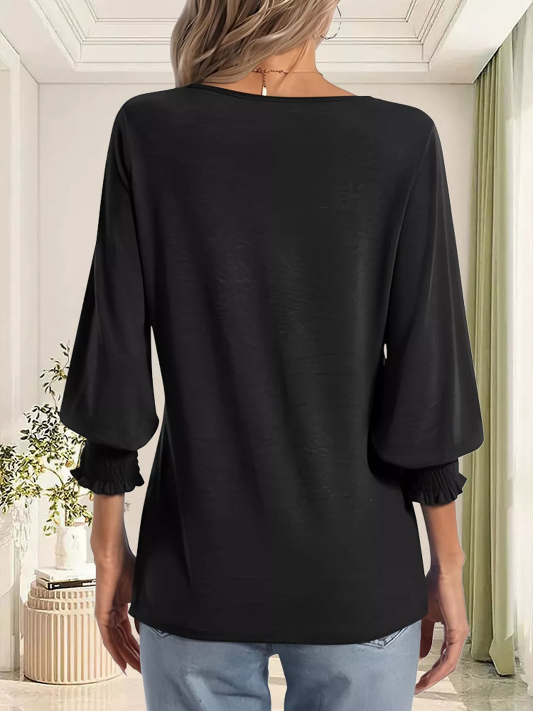 Notched V-neck three-quarter sleeve top with smocked cuffs