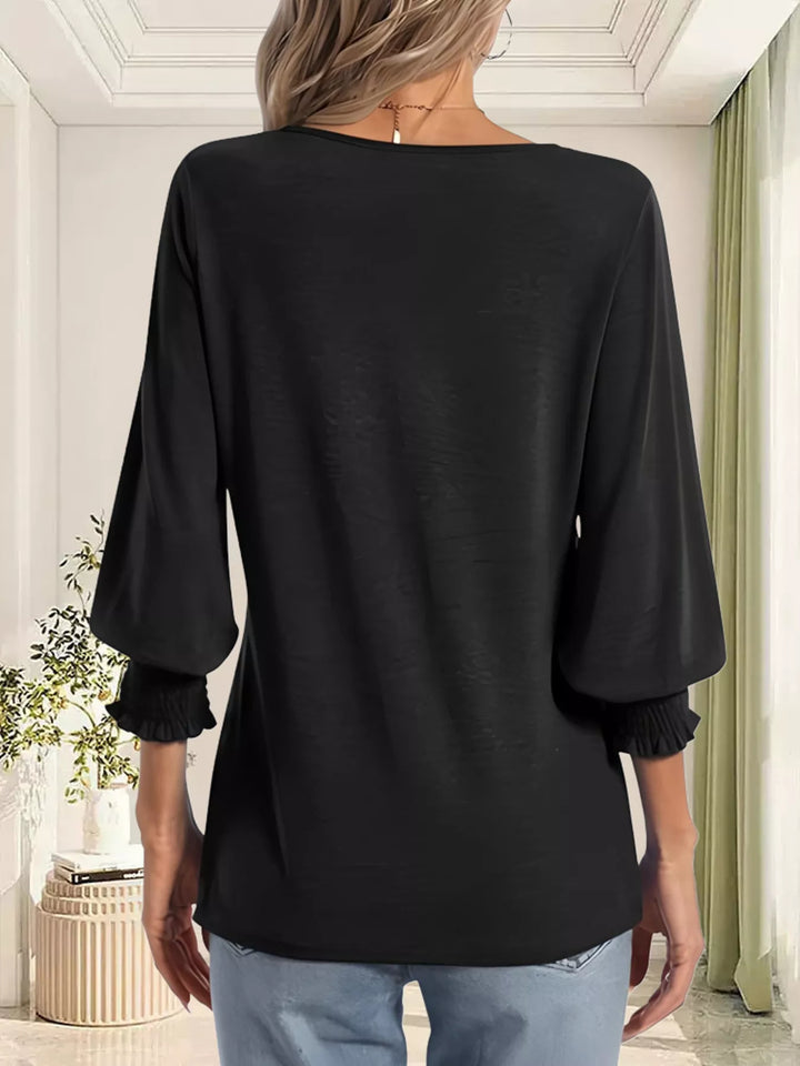 Notched V-neck three-quarter sleeve top with smocked cuffs