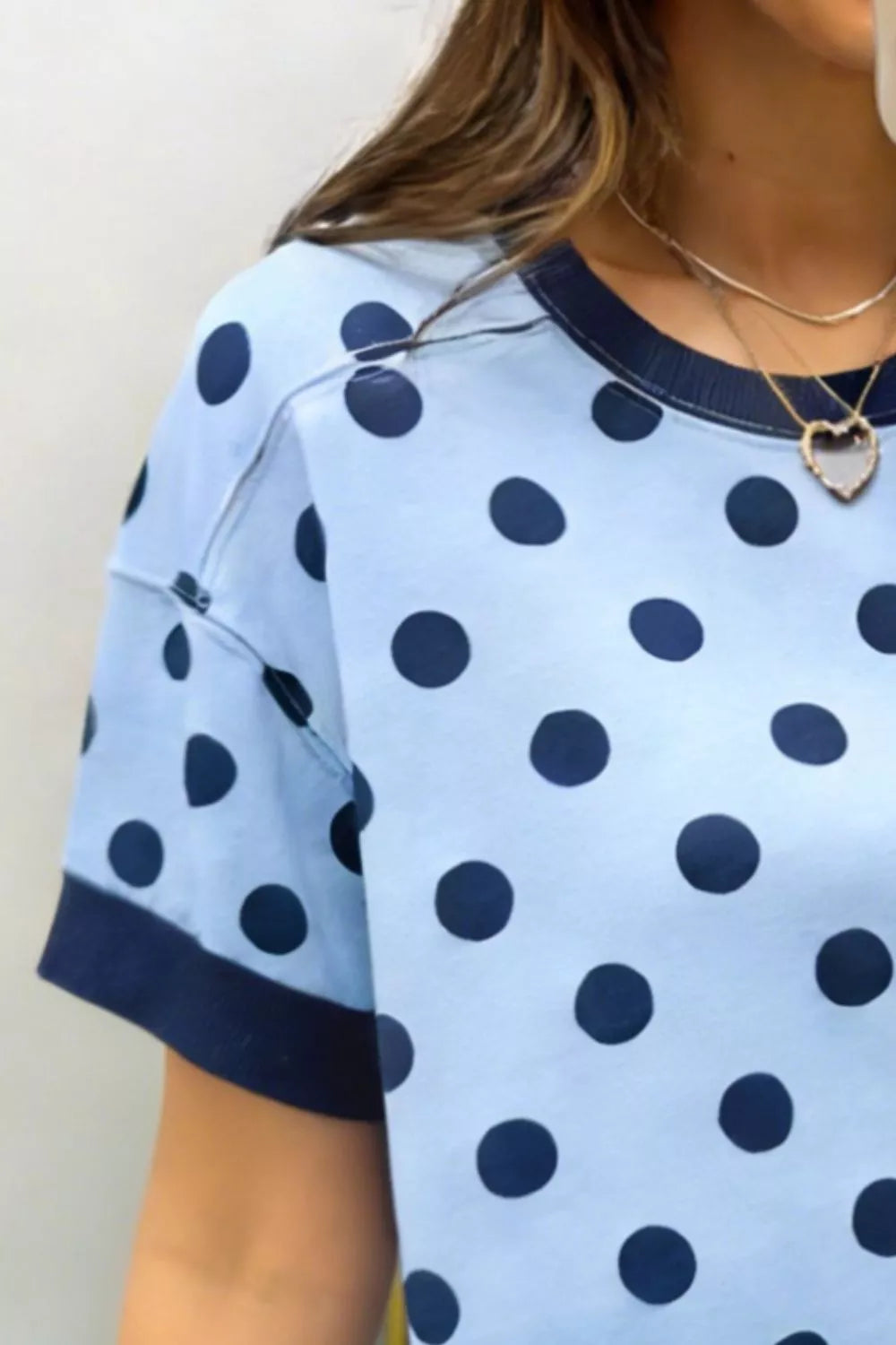 Polka dot short sleeve knit top with ribbed contrast trim