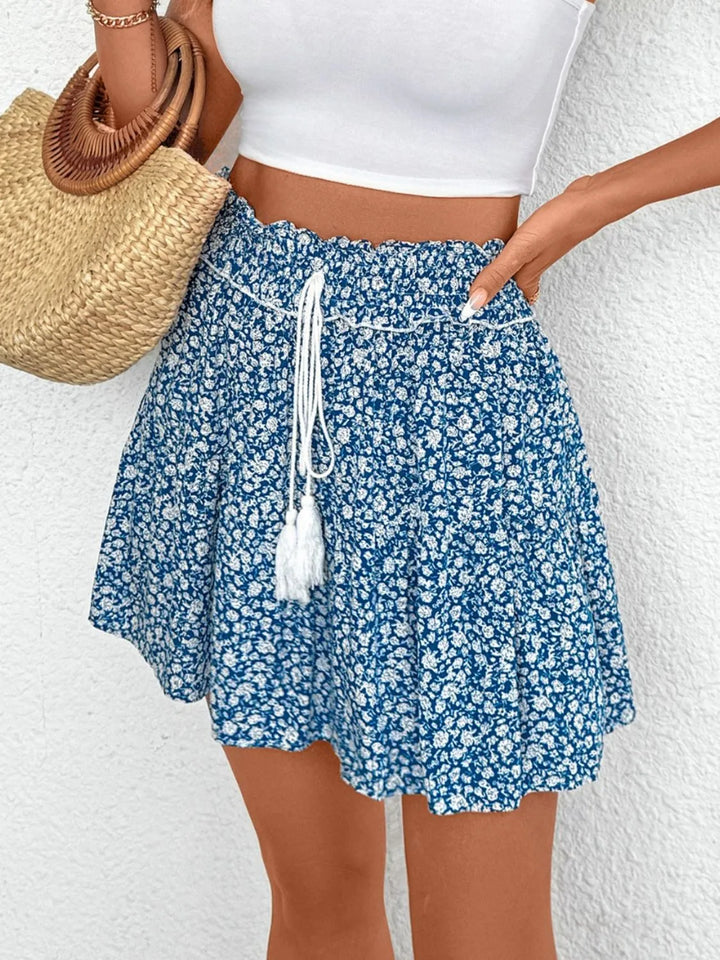 Tiered floral mini skirt with tassel tie waist