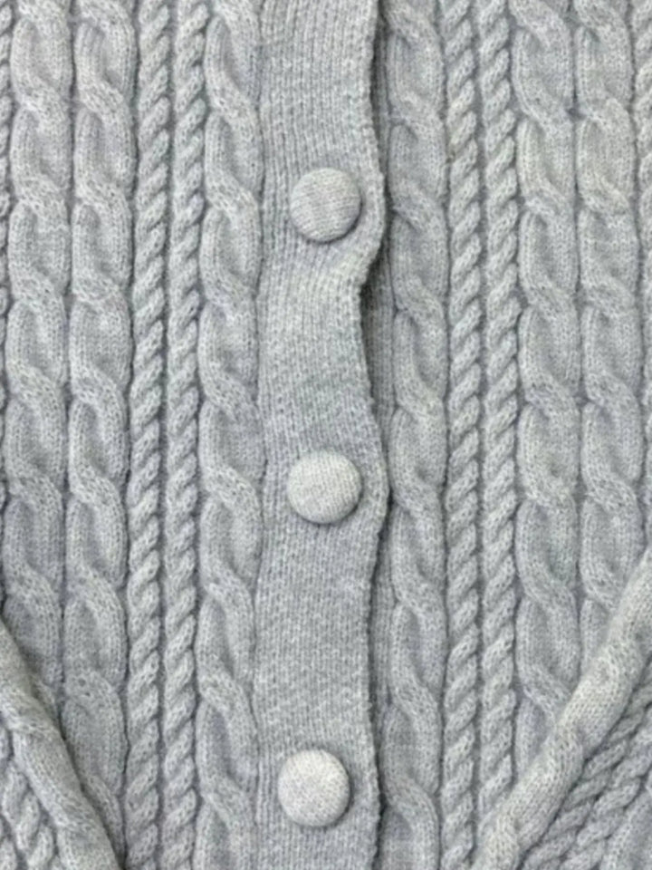 Cropped cable knit button-up cardigan with ribbed cuffs