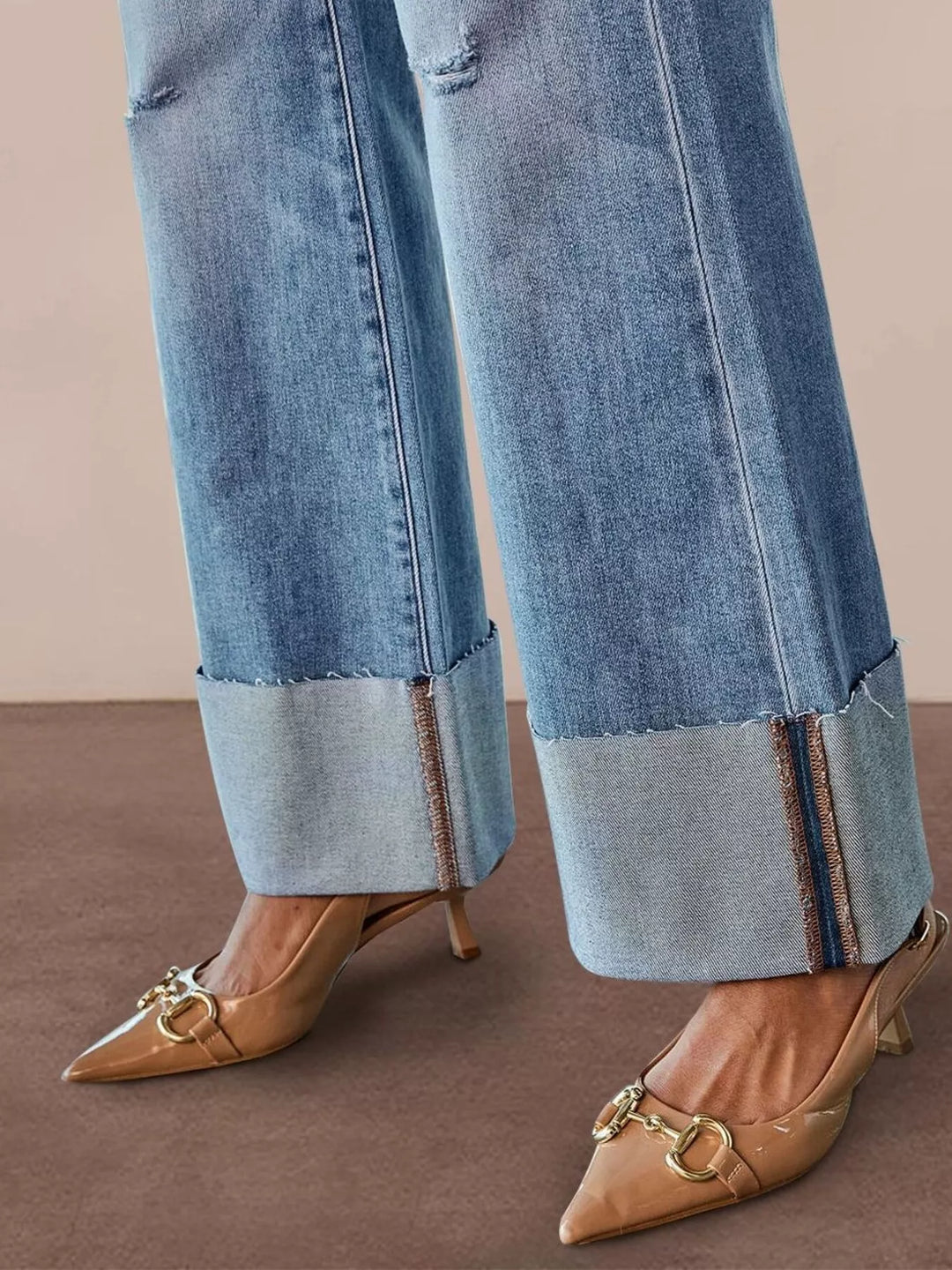 Distressed high-rise flare jeans with raw cuffed hem