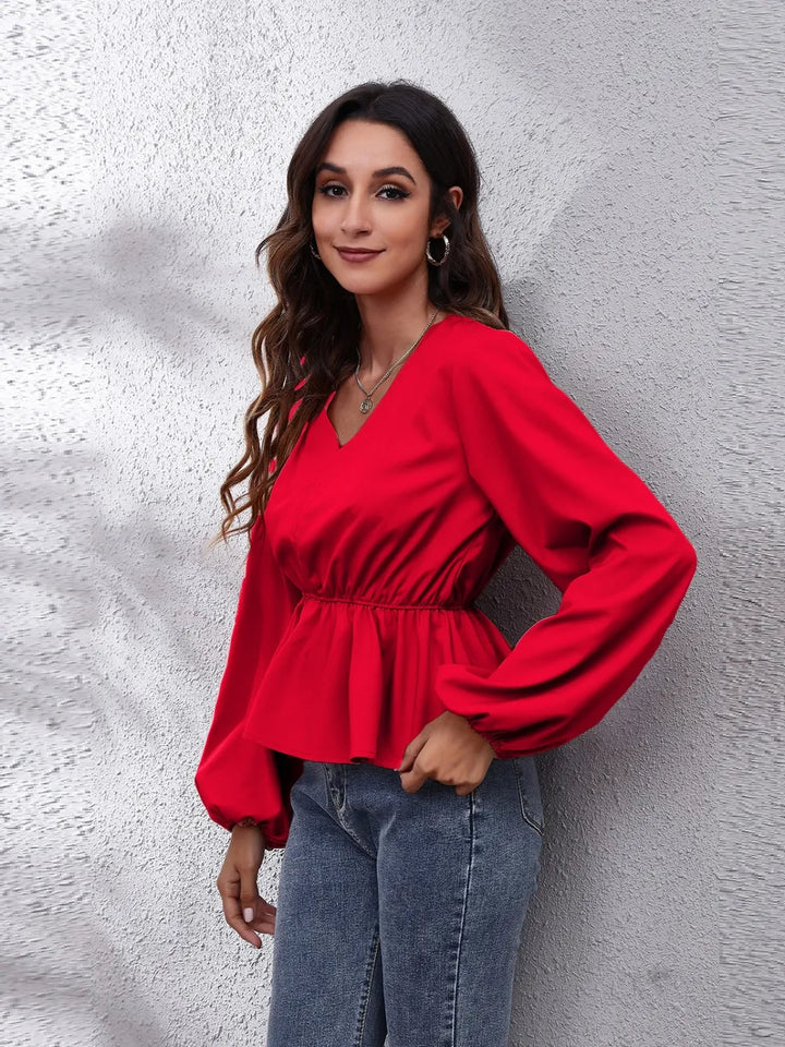 Balloon sleeve peplum blouse with V-neck