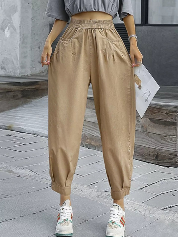 Pleated harem pants with elastic waist and tapered cuffs