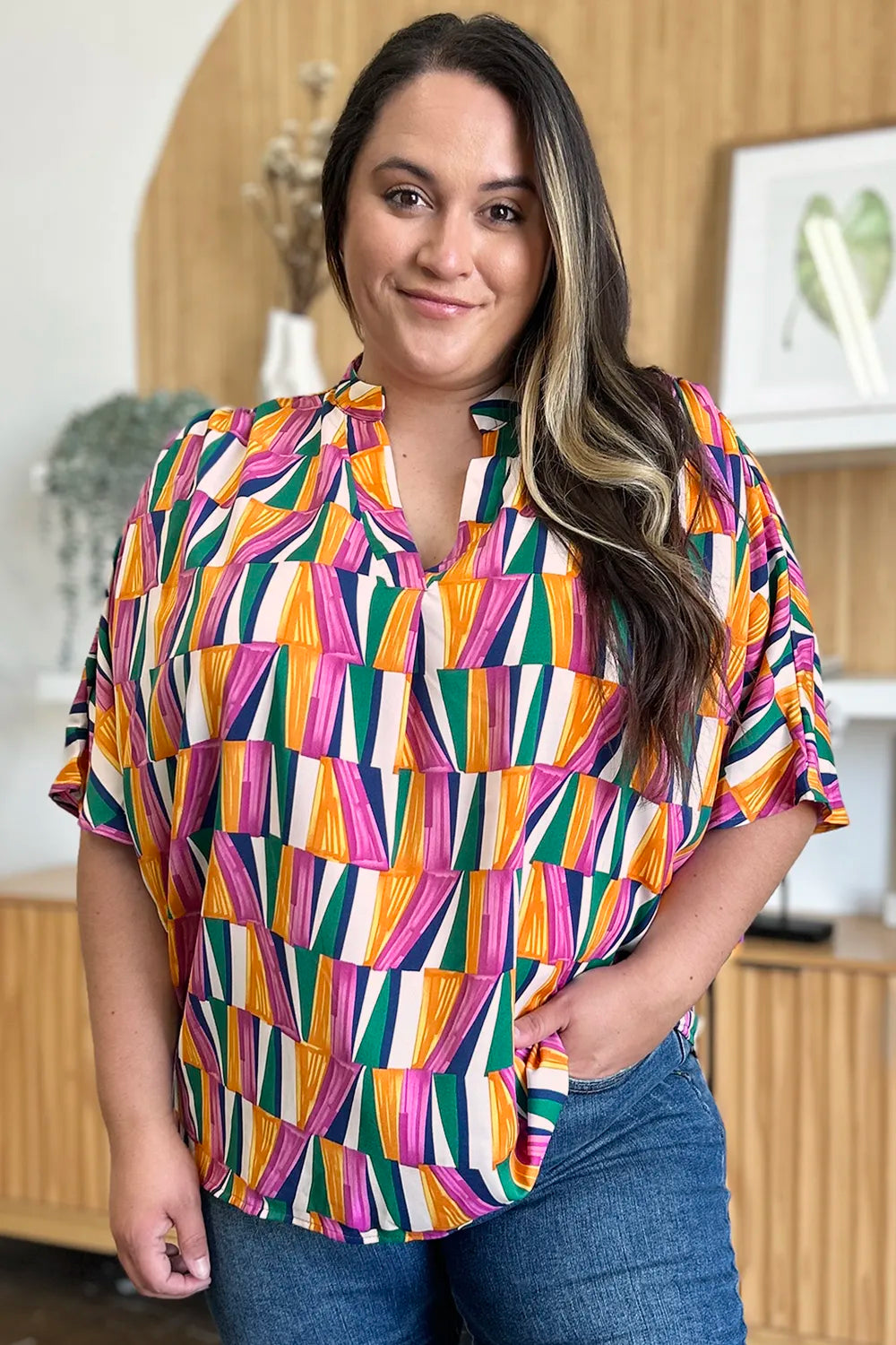 Geometric print notched neck dolman sleeve top