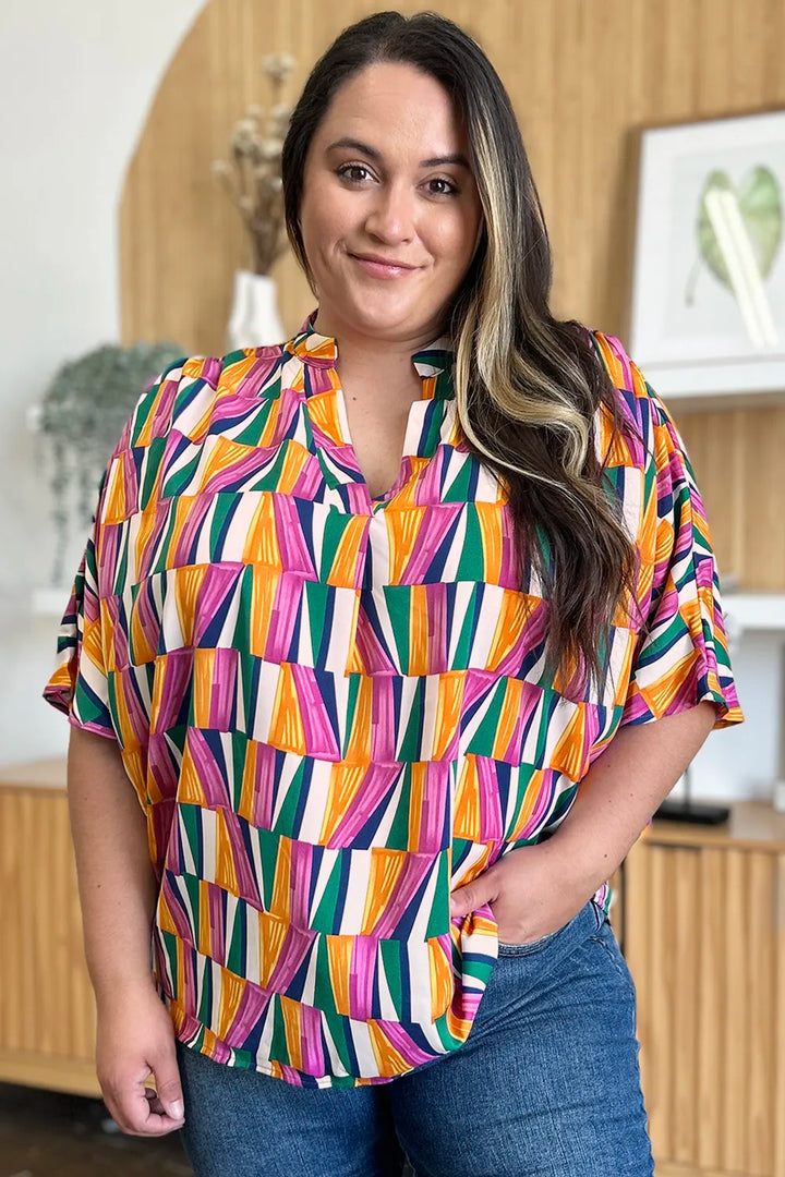 Geometric print notched neck dolman sleeve top