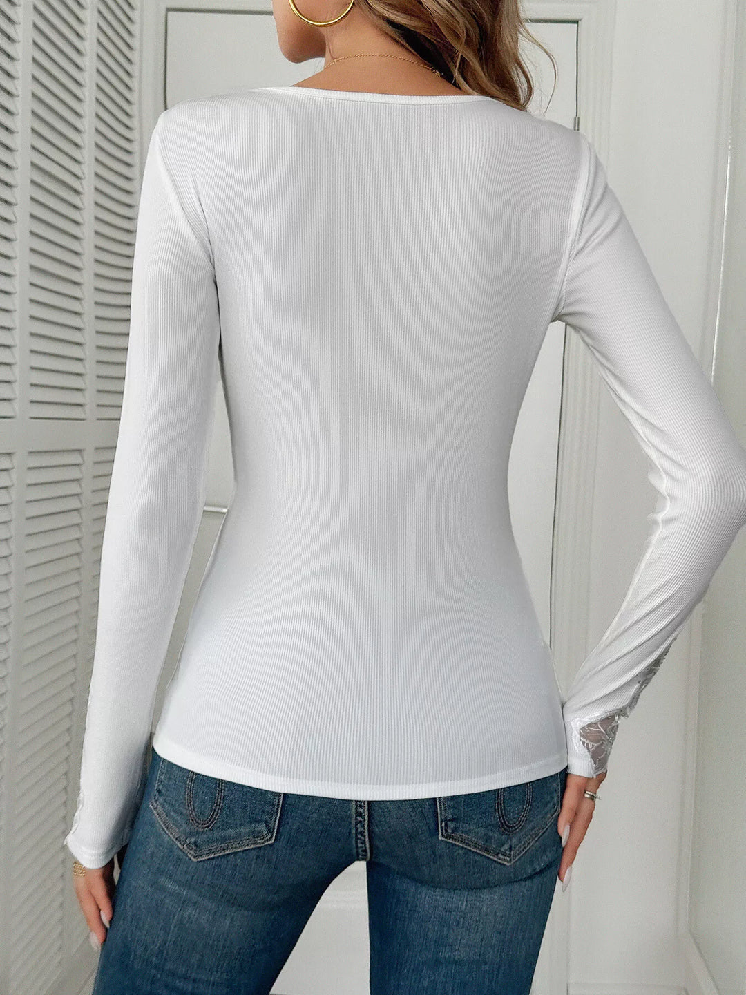 Ribbed knit top with floral lace trim and rhinestones
