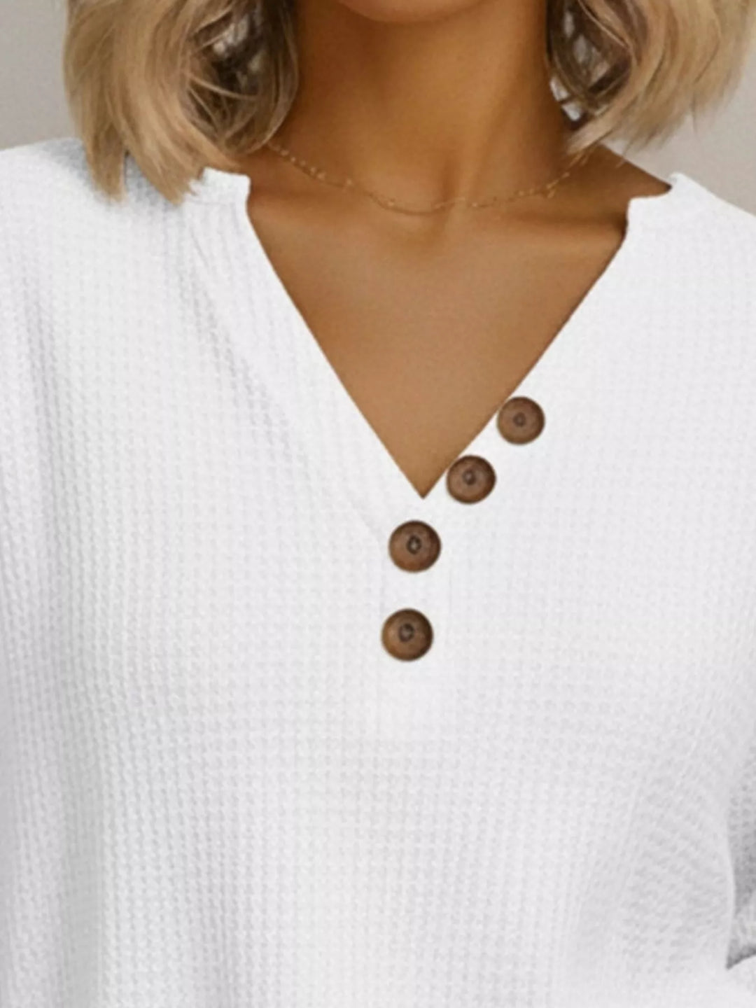 Waffle-knit long sleeve henley top with buttoned V-neck