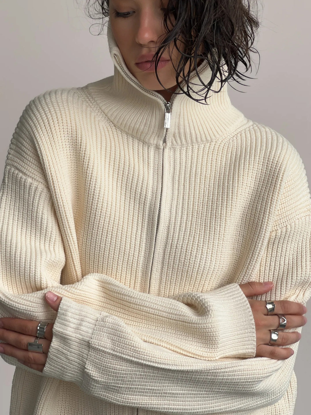 Cream Zip-up ribbed knit cardigan with funnel neck and drop shoulders