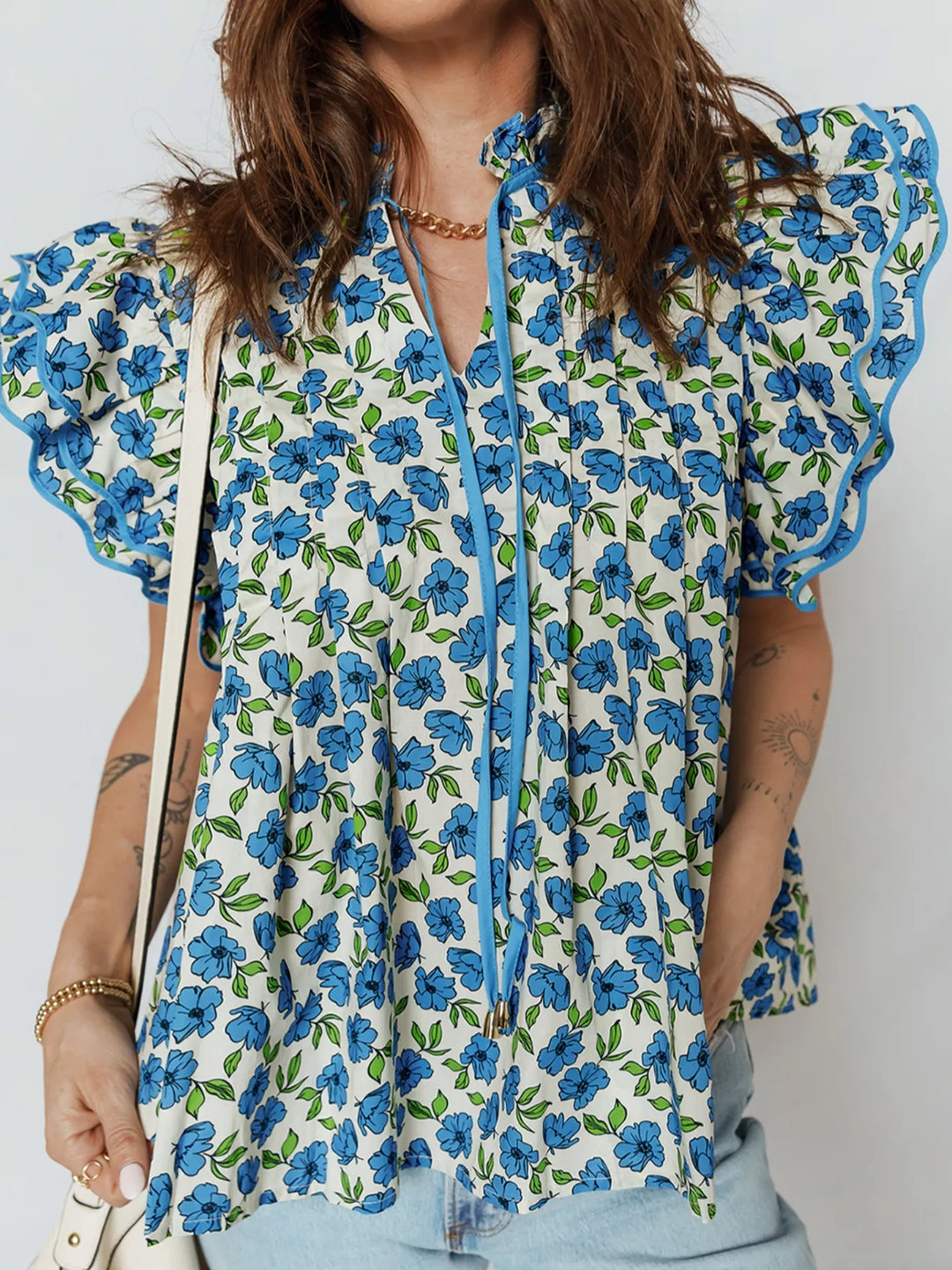Floral ruffle flutter sleeve tie-neck blouse