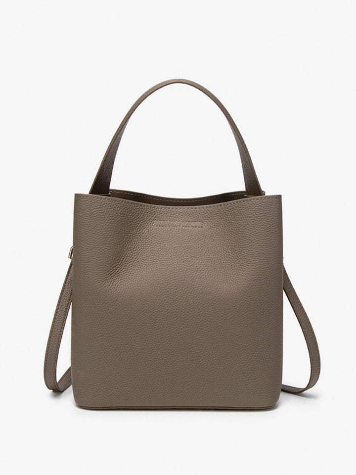 Pebbled faux leather bucket crossbody bag with twist lock