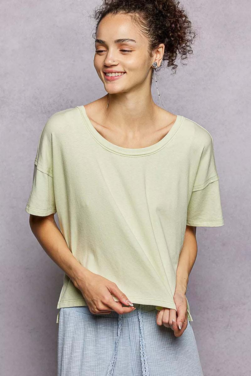 Relaxed short sleeve tee with high-low hem and exposed seams