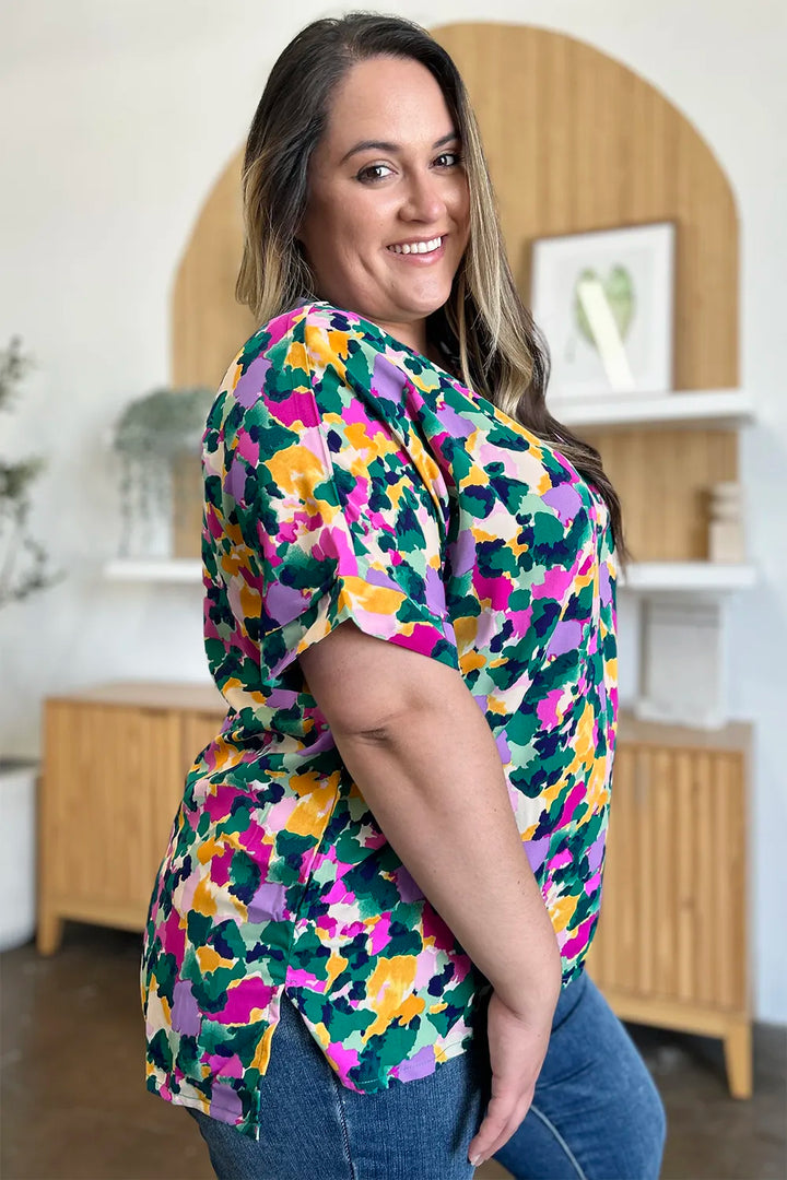 Abstract print v-neck tunic top with flutter sleeves and side slits