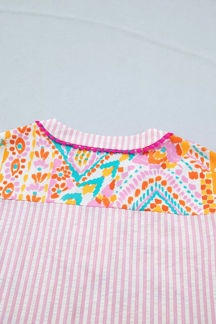 Patchwork mixed print blouse with ruffle sleeves and pom-pom trim