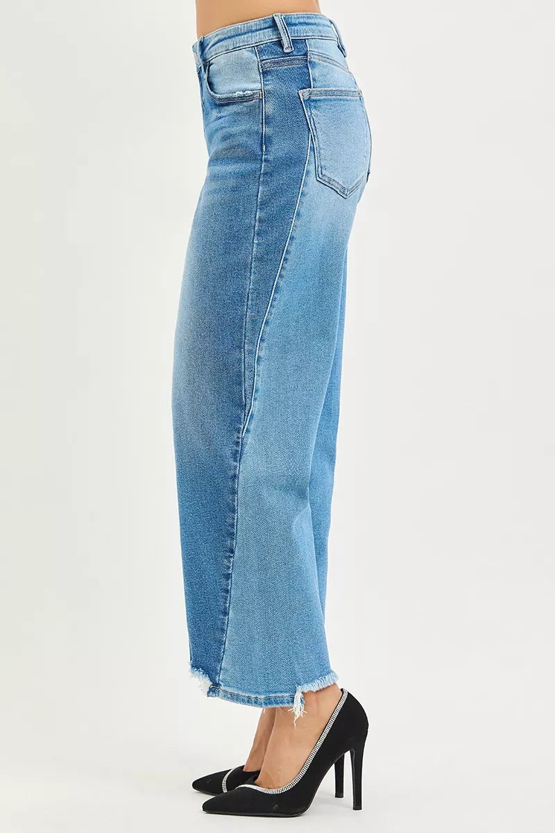 Slouchy cropped barrel-leg jeans with contrast wash and raw hem