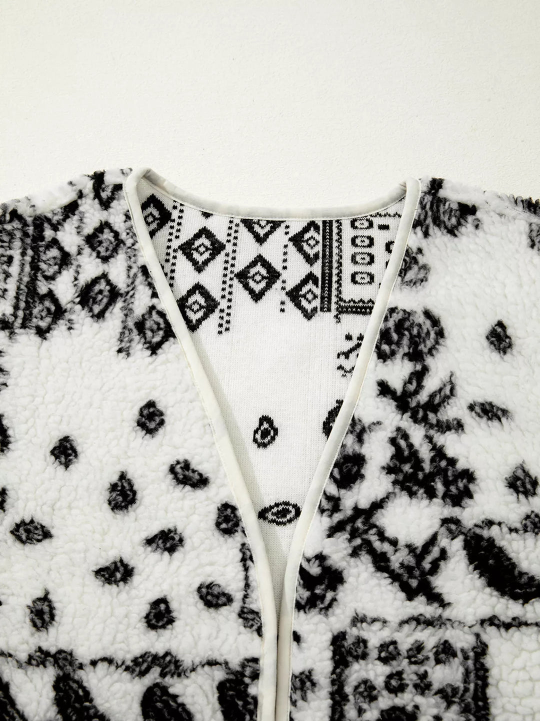 Open-front sherpa vest with paisley print and patch pockets